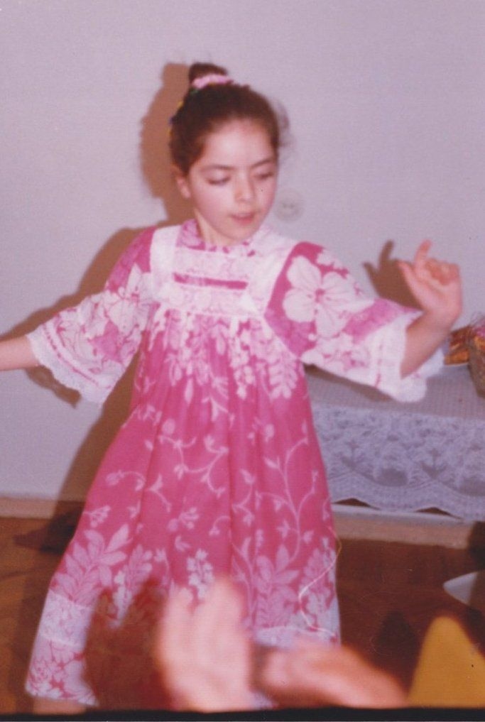 Jess dancing in a pink floral dress